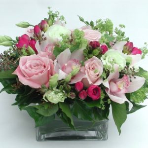 A beautiful mix of light & dark pink roses mixed with green foliage created by Cottesloe Flowers.