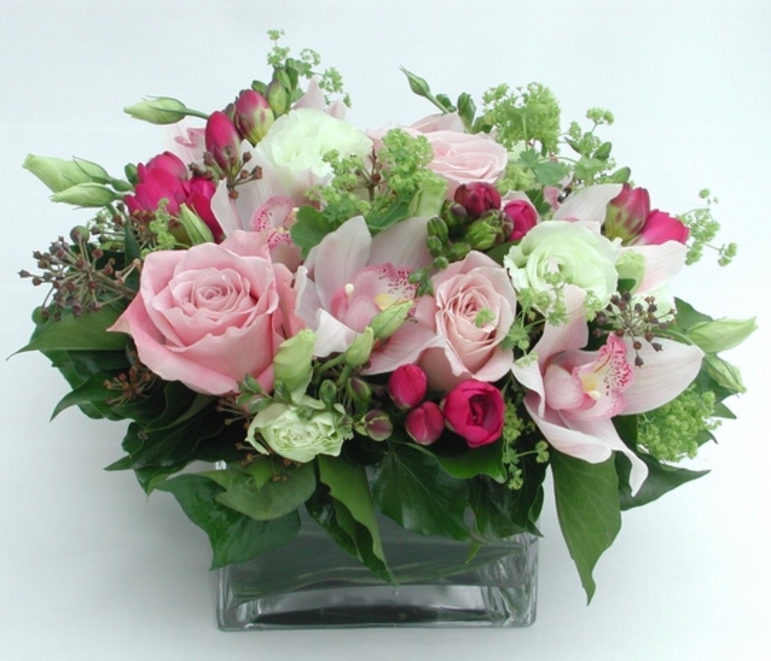 A beautiful mix of light & dark pink roses mixed with green foliage created by Cottesloe Flowers.